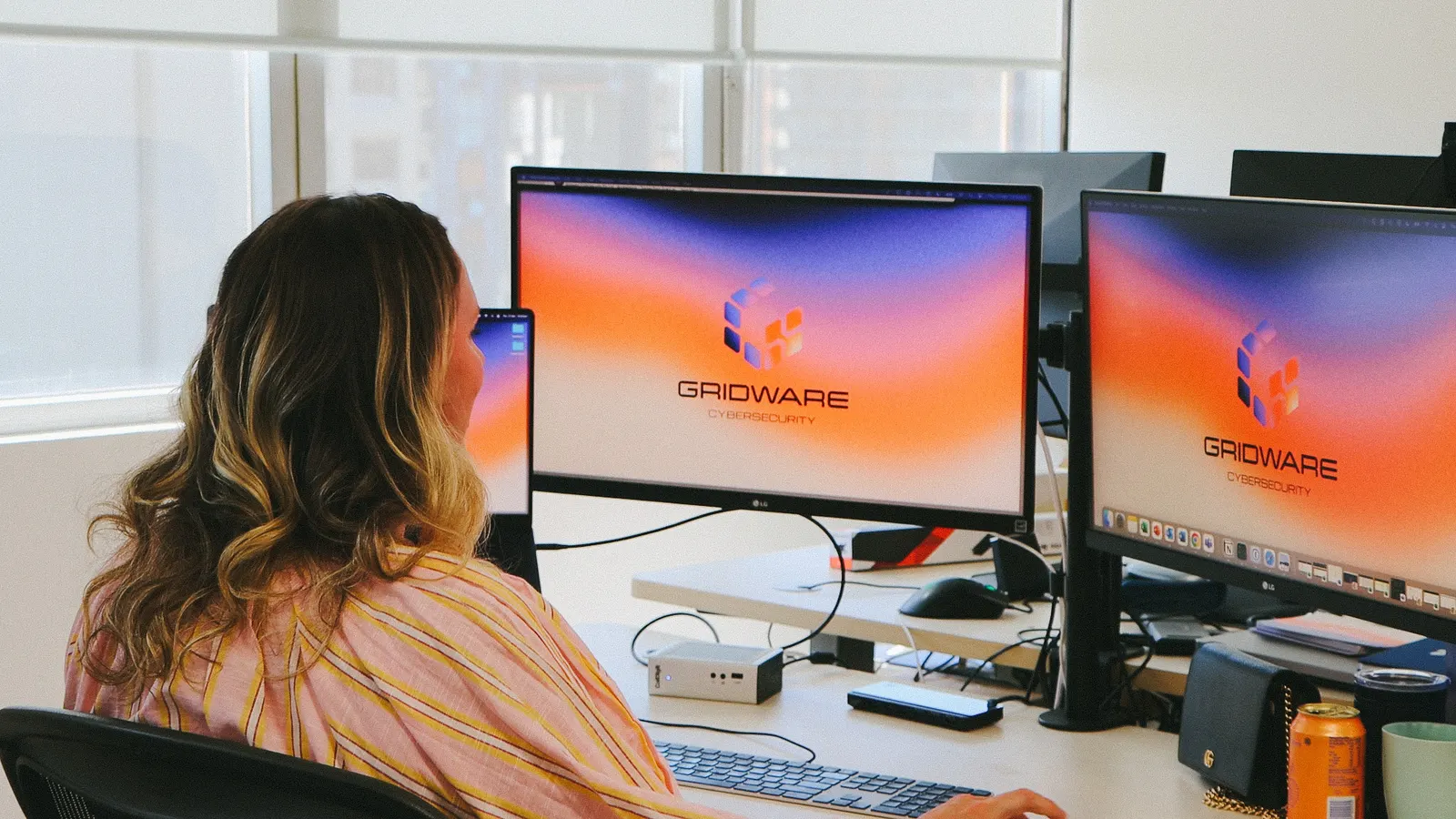 Gridware employee sat at their computer working